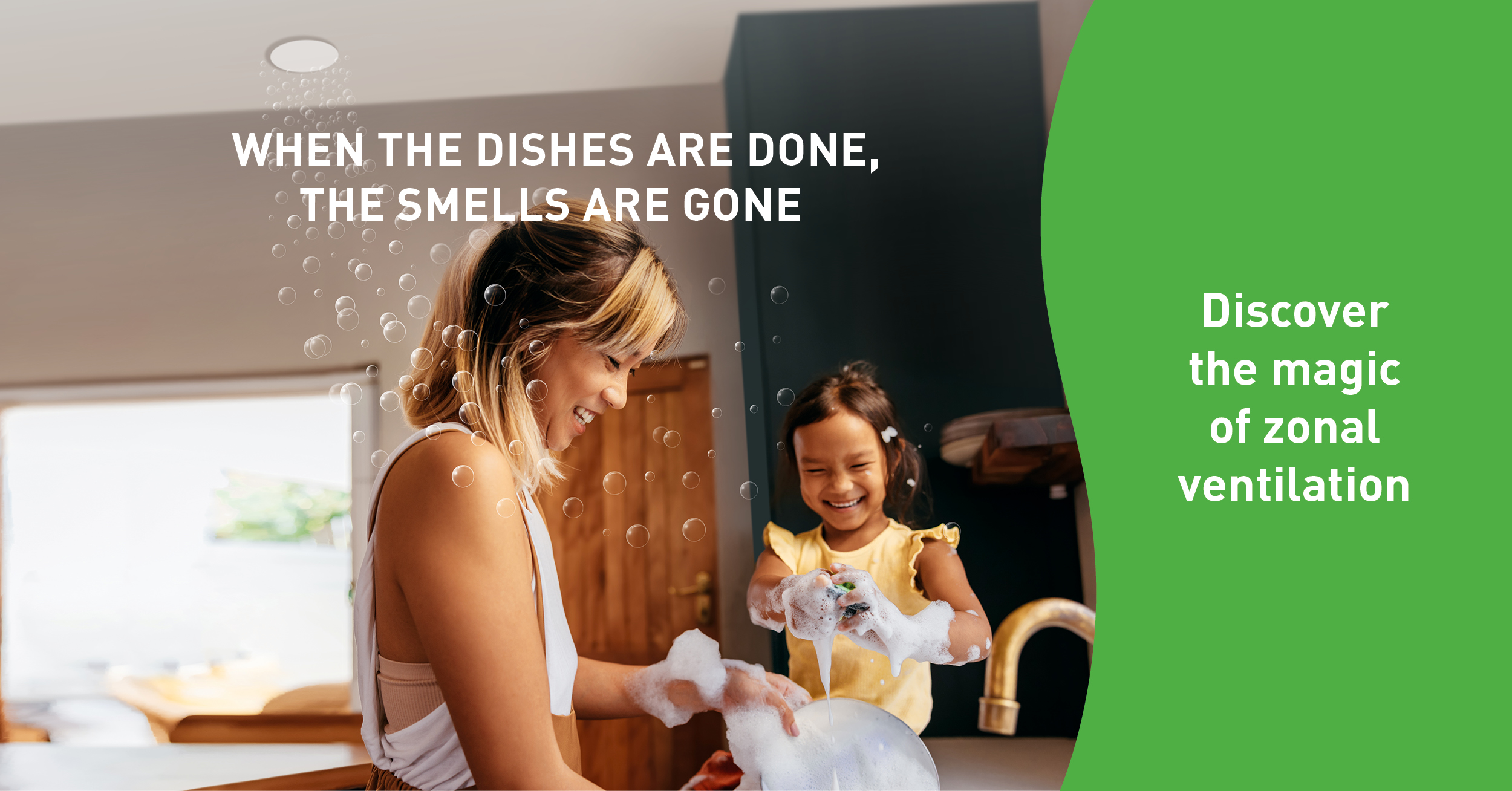 Mother and daughter smiling while doing the dishes together.